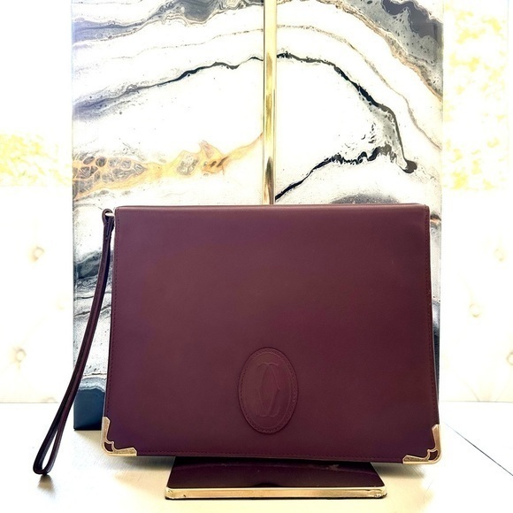Cartier Handbags - Cartier Burgundy Clutch